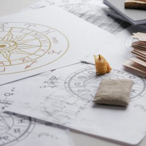 Astrology. Astrologer calculates natal chart and makes a forecast of fate Tarot cards